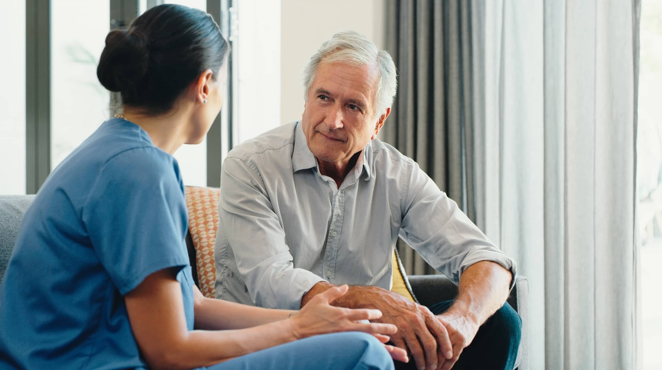 doctor talking to older patient