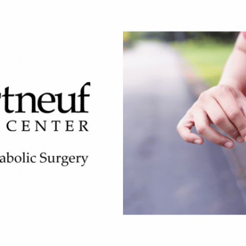 Close-up of a person in a red shirt wrapping a measuring tape around their waist